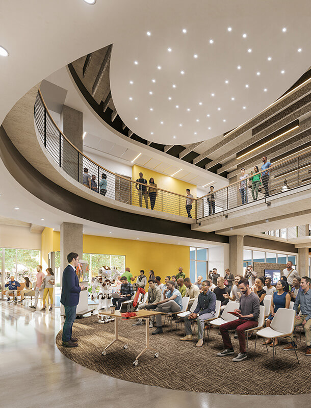 A man delivers a lecture in a two-story gathering hall